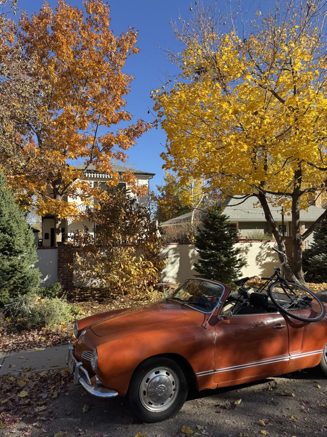 The Karmann Ghia in Boulder fall, bike resting on the back